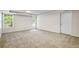 Basement with a door to the exterior and a large window providing light at 1213 Blue Springs Dr, Loganville, GA 30052