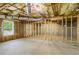 Unfinished basement with concrete floor and exposed framing, ready for customization at 1213 Blue Springs Dr, Loganville, GA 30052