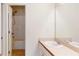 Bright bathroom featuring a white vanity and a shower/tub combination at 1213 Blue Springs Dr, Loganville, GA 30052