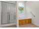 Bathroom featuring a walk-in shower, soaking tub, and stained glass window at 1213 Blue Springs Dr, Loganville, GA 30052