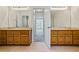 Bright bathroom featuring double vanities and tile floors at 1213 Blue Springs Dr, Loganville, GA 30052