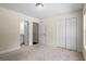Carpeted bedroom with closet and bathroom access offers versatile space at 1213 Blue Springs Dr, Loganville, GA 30052