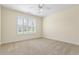 Bedroom featuring a ceiling fan, window with shade and neutral carpet at 1213 Blue Springs Dr, Loganville, GA 30052