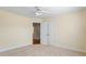 Bedroom with neutral paint, carpet, ceiling fan and double door closet at 1213 Blue Springs Dr, Loganville, GA 30052