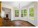 Breakfast nook featuring wainscotting, hardwood floors, and large windows at 1213 Blue Springs Dr, Loganville, GA 30052
