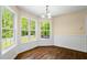Bright breakfast nook featuring hardwood floors and large windows with scenic views at 1213 Blue Springs Dr, Loganville, GA 30052