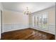 Bright dining room with hardwood floors, wainscoting, and plantation shutters at 1213 Blue Springs Dr, Loganville, GA 30052