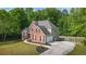 Charming two-story brick home with a well-manicured lawn and an attached garage at 1213 Blue Springs Dr, Loganville, GA 30052