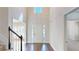 Grand foyer showcasing hardwood floors, a high ceiling, and a staircase at 1213 Blue Springs Dr, Loganville, GA 30052