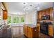Bright kitchen featuring a center island, stainless steel appliances, hardwood floors, and adjacent breakfast nook at 1213 Blue Springs Dr, Loganville, GA 30052
