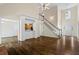 Bright living room with hardwood floors and staircase at 1213 Blue Springs Dr, Loganville, GA 30052