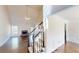 Living room featuring hardwood floors, a cozy fireplace, staircase, and lots of natural light at 1213 Blue Springs Dr, Loganville, GA 30052