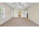 Bright main bedroom features a trey ceiling, carpet floors, and an ensuite bathroom at 1213 Blue Springs Dr, Loganville, GA 30052