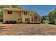 Expansive backyard with a large home featuring many windows overlooking the lawn at 1704 Yarborough Dr, Peachtree City, GA 30269