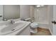 Bright bathroom featuring a modern vanity with a large mirror and a shower-tub combo at 1704 Yarborough Dr, Peachtree City, GA 30269