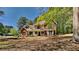 Charming two-story brick home with a welcoming front porch and well-manicured landscaping at 1704 Yarborough Dr, Peachtree City, GA 30269