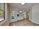 Bright kitchen area showcasing white cabinetry, stainless steel appliances, and wood-look flooring at 1704 Yarborough Dr, Peachtree City, GA 30269