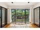 Empty balcony with large sliding glass doors offering water views at 23310 Plantation Ne Dr, Atlanta, GA 30324