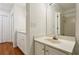 Bright bathroom featuring a modern vanity, large mirror, and tiled shower with glass door at 23310 Plantation Ne Dr, Atlanta, GA 30324