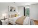 Stylish bedroom with a comfortable bed, modern decor, and bright window view at 23310 Plantation Ne Dr, Atlanta, GA 30324