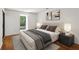 Serene main bedroom with hardwood floors, calming decor, and a view of lush greenery at 23310 Plantation Ne Dr, Atlanta, GA 30324