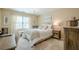 Inviting bedroom features neutral tones, a chandelier, a window, and a cozy rug at 2566 Garrison Sw, Marietta, GA 30064