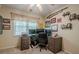 Bedroom featuring a ceiling fan and natural light from the window, creating a comfortable atmosphere at 2566 Garrison Sw, Marietta, GA 30064