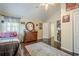 Bedroom featuring a ceiling fan, wall decorations, and wood floors, creating a distinct atmosphere at 2566 Garrison Sw, Marietta, GA 30064