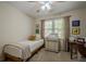 Sun-filled bedroom features neutral walls and decor and offers a calm and relaxing atmosphere at 2566 Garrison Sw, Marietta, GA 30064