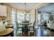 Bright dining area features a wooden table and dark wood floors that enhance the home's cozy atmosphere at 2566 Garrison Sw, Marietta, GA 30064