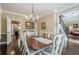 Traditional dining room with hardwood floors leading to an open kitchen and living area at 2566 Garrison Sw, Marietta, GA 30064