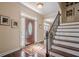 Foyer with dark hardwood floors, white trim, and a front door with decorative glass at 2566 Garrison Sw, Marietta, GA 30064