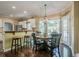An eat-in kitchen features stainless steel appliances, bar seating, and lots of natural light at 2566 Garrison Sw, Marietta, GA 30064