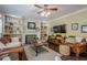 A comfortable living room with fireplace and bookshelves makes a great space for relaxing and entertaining at 2566 Garrison Sw, Marietta, GA 30064