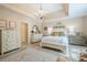 This large main bedroom features neutral walls, soft carpet, and ensuite bathroom entrance at 2566 Garrison Sw, Marietta, GA 30064