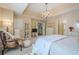 Comfortable main bedroom featuring a neutral palette, soft carpet, and access to the ensuite bathroom at 2566 Garrison Sw, Marietta, GA 30064