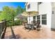 Spacious wooden deck with outdoor dining set and umbrella at 4415 Dorset Ln, Suwanee, GA 30024
