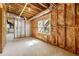 Unfinished basement with exposed insulation, ductwork, and a double window at 4415 Dorset Ln, Suwanee, GA 30024