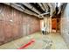 Basement features exposed insulation, ductwork, concrete floors, and a utility sink at 4415 Dorset Ln, Suwanee, GA 30024