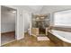 Spacious bathroom features a soaking tub, glass shower, tile floor, and an attached walk-in closet at 4415 Dorset Ln, Suwanee, GA 30024