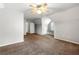 Bedroom with vaulted ceilings, ceiling fan, window seat, and neutral walls and carpet at 4415 Dorset Ln, Suwanee, GA 30024