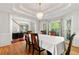 Elegant dining room with coffered ceiling and hardwood floors at 4415 Dorset Ln, Suwanee, GA 30024