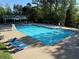 Fantastic community pool with covered seating, lifeguard stand, and plenty of chairs for all the neighbors to enjoy at 4415 Dorset Ln, Suwanee, GA 30024