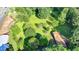 Large green lot with established trees on a desirable street, ready for a new home at 5690 Abbotts Bridge Rd, Johns Creek, GA 30097