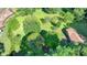 Beautiful green lot with mature trees on a sunny day, perfect for building your dream home at 5690 Abbotts Bridge Rd, Johns Creek, GA 30097