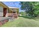 Home's covered back porch, offering a comfortable view of the backyard at 5690 Abbotts Bridge Rd, Johns Creek, GA 30097
