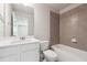 Bathroom features a tiled shower/tub combo and white vanity at 787 Belrose Dr, Smyrna, GA 30080