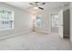 Bedroom with a ceiling fan, two windows and an open door to another room at 787 Belrose Dr, Smyrna, GA 30080
