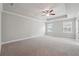 Primary bedroom features a tray ceiling, neutral paint and carpet at 787 Belrose Dr, Smyrna, GA 30080