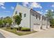 Charming townhome featuring gray siding, an attached garage, and neatly manicured landscaping at 787 Belrose Dr, Smyrna, GA 30080